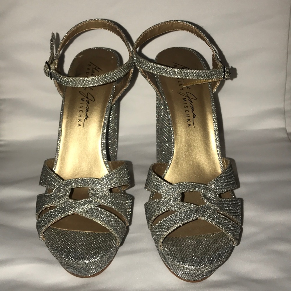 Silver open toe high heels.